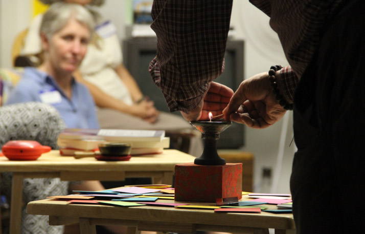 A meeting gets started with the lighting of a chalice: the flaming chalice is a symbol of our faith.